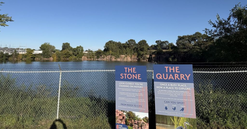 The old quarry by Falls Park, with signs telling its story