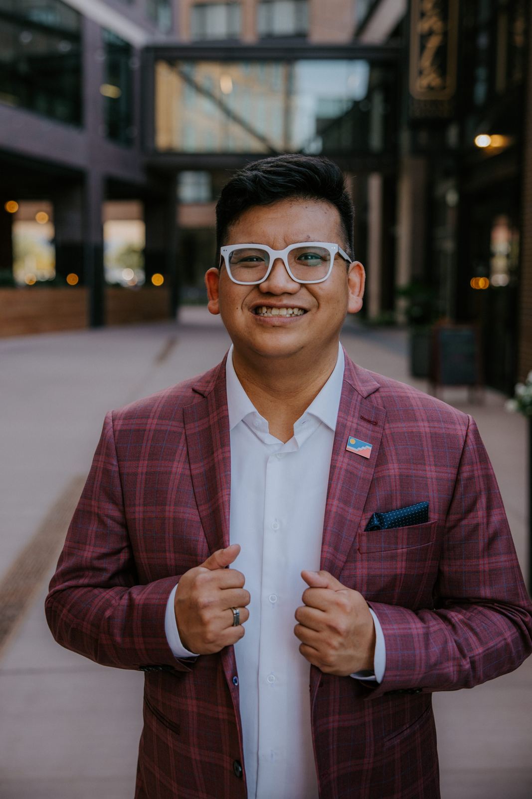 Portrait of Vince Danh in a red plaid blazer