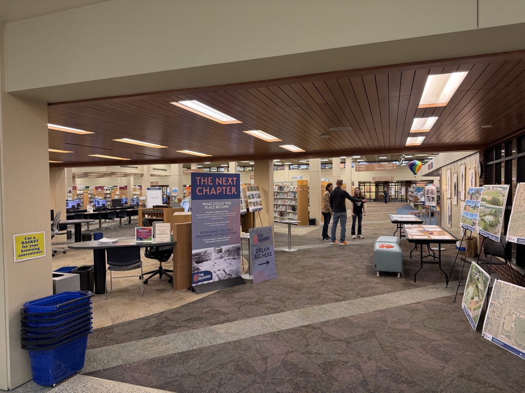 The Quarry display at the Downtown Library, with planning boards and site maps on easels