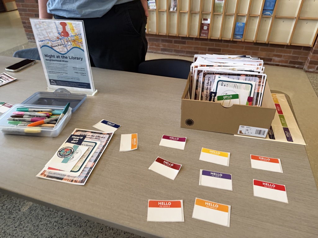 Name tags and markers on the welcome table at Night at the Library, a neighborhood mixer at the Downtown Library
