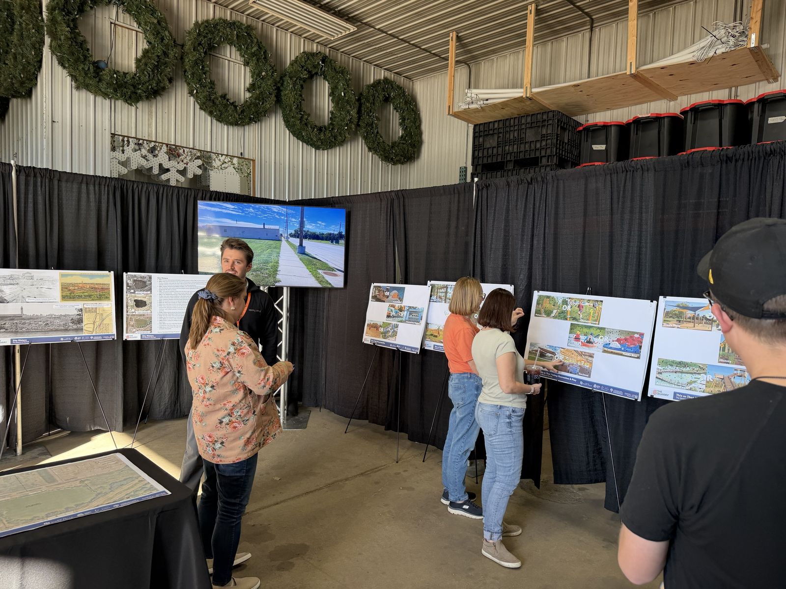 Residents vote on "this or that" idea boards inside the warehouse