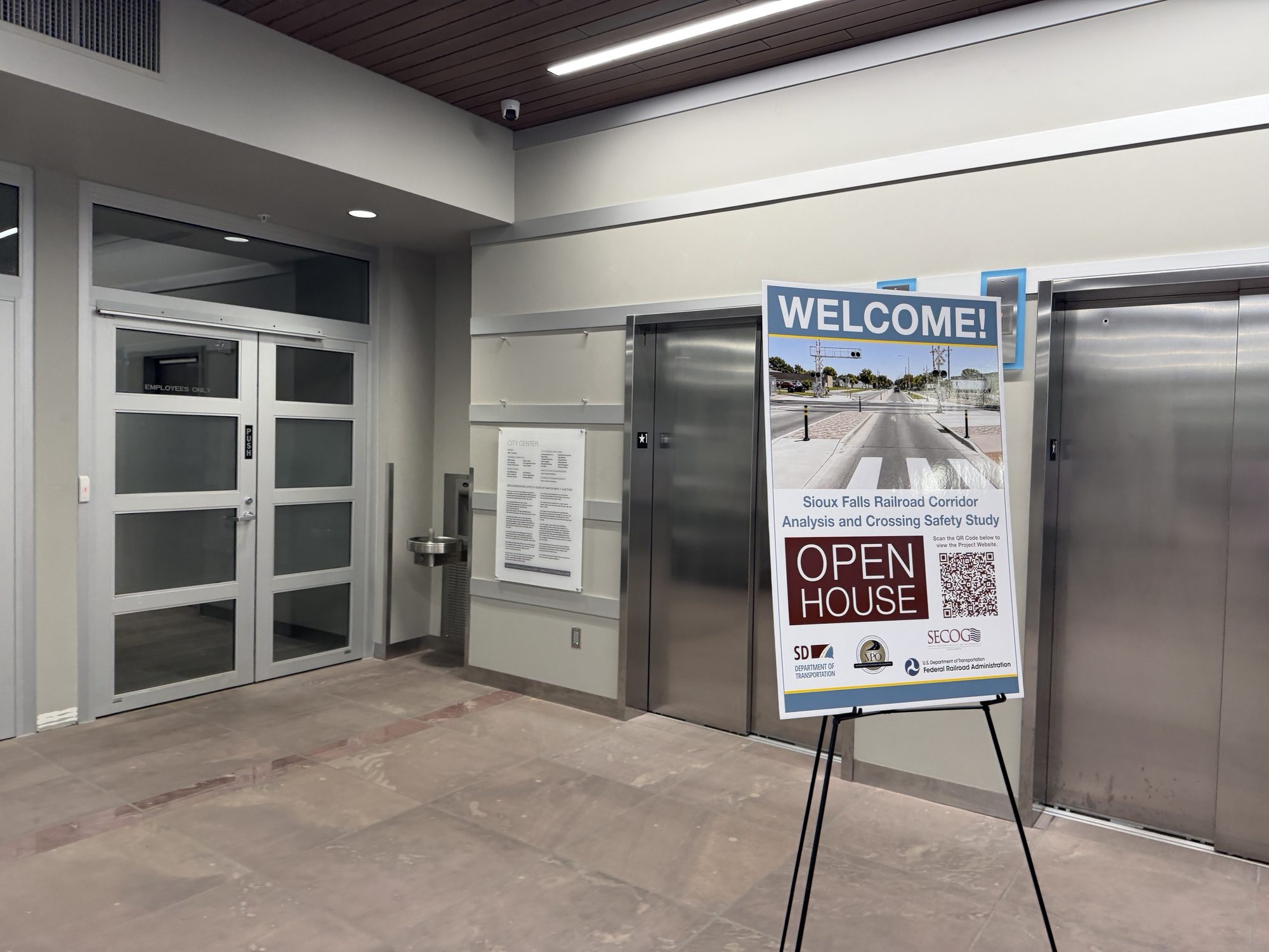 Welcome sign for the Sioux Falls Railroad Corridor Analysis and Crossing Safety Study open house, next to the elevators at City Center