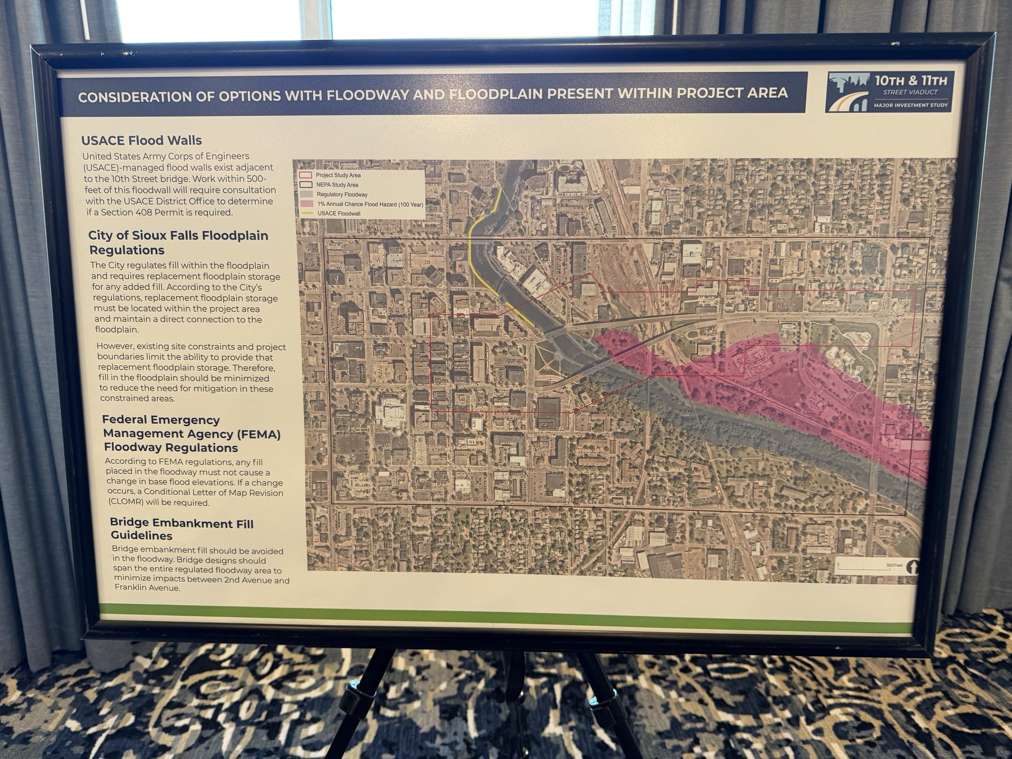 Board titled Consideration of Options with Floodway and Floodplain Present within Project Area, with a map of the river floodway in the project area