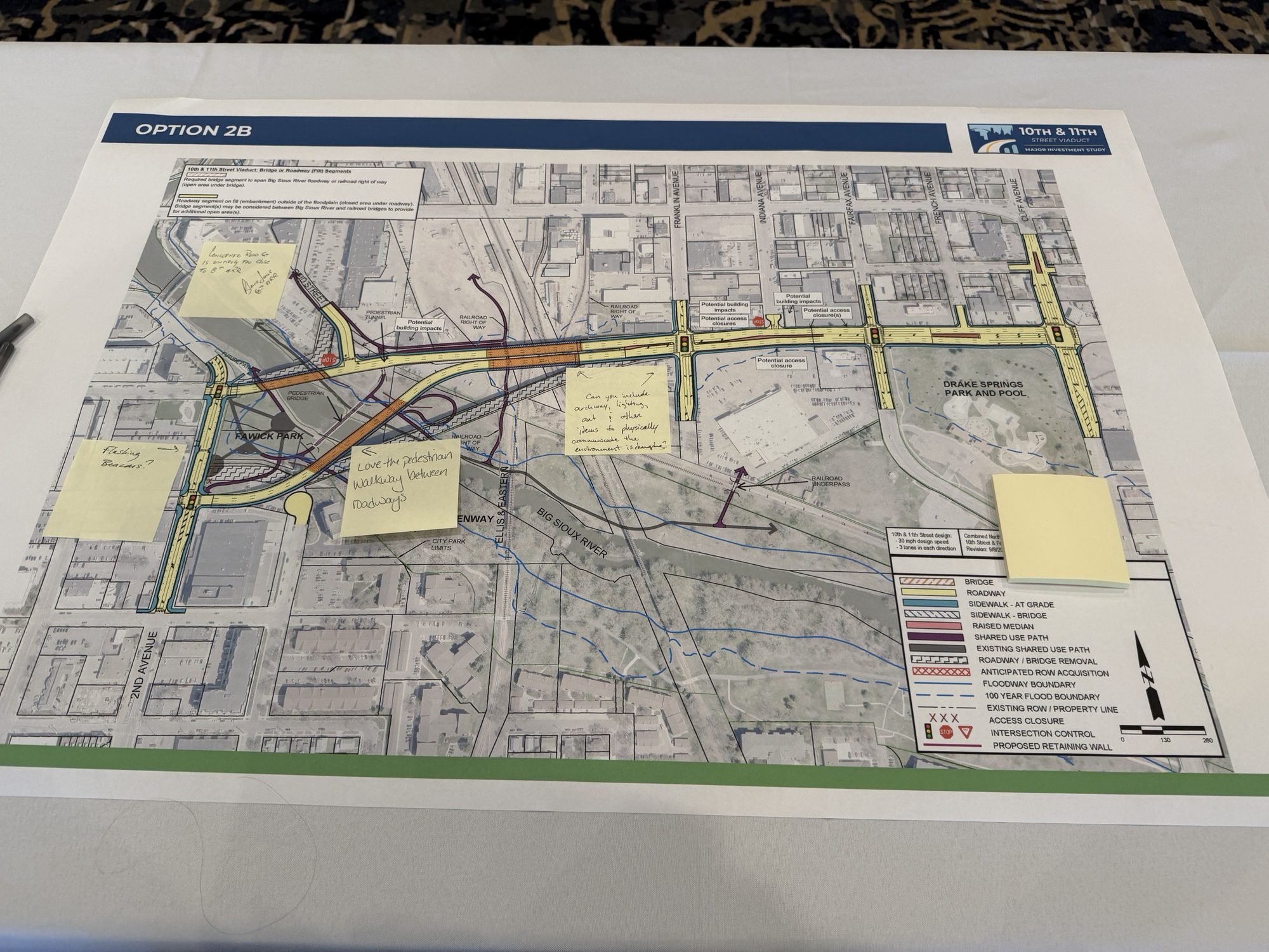 The Option 2B map with yellow sticky notes from visitors, including one that says love the pedestrian walkway between roadways